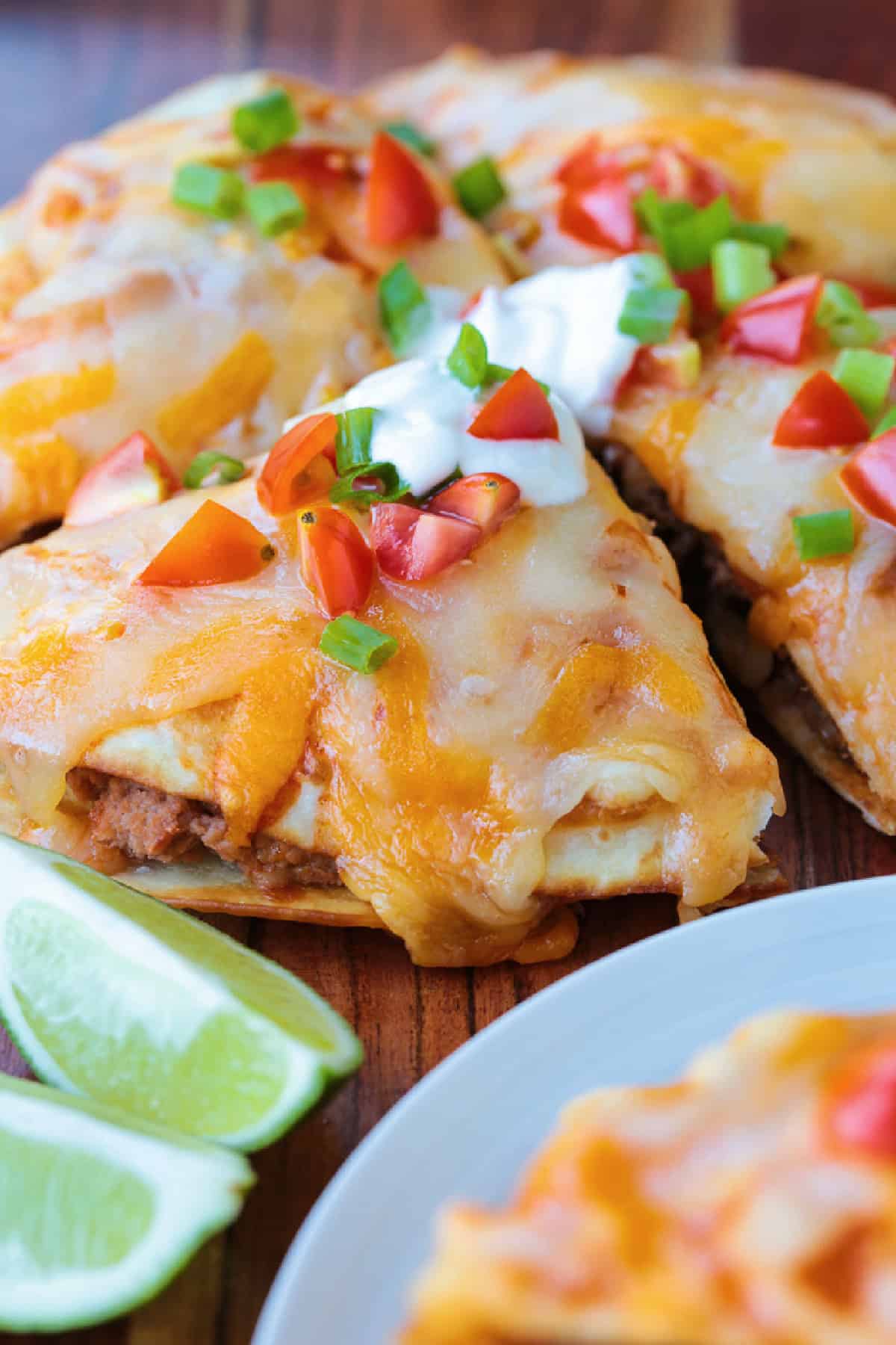 mexican pizza cut into wedges with toppings
