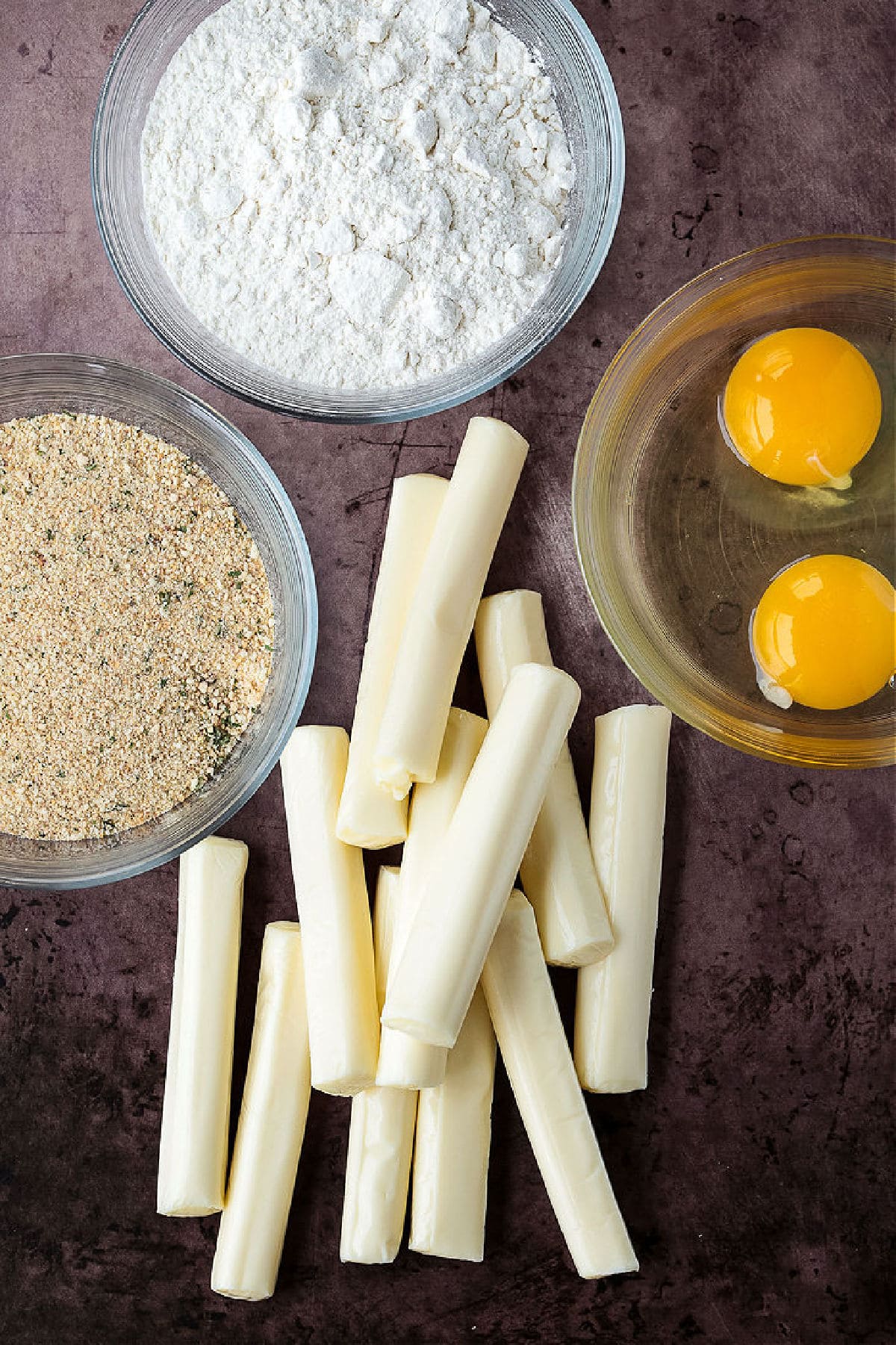 Air Fryer Mozzarella Sticks turn out fabulously crispy without any oil! Brown and crispy on the outside and cheese-pull worthy on the inside! ingredients for making homemade mozzarella sticks