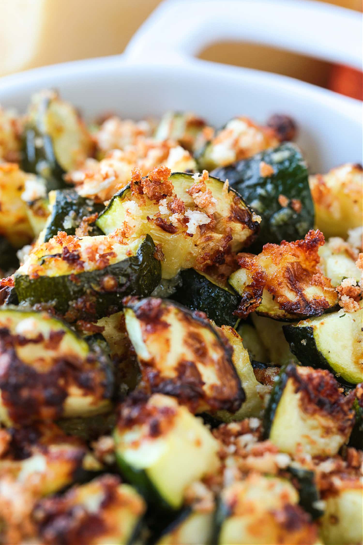 A close up of air fryer zucchini in an oven dish