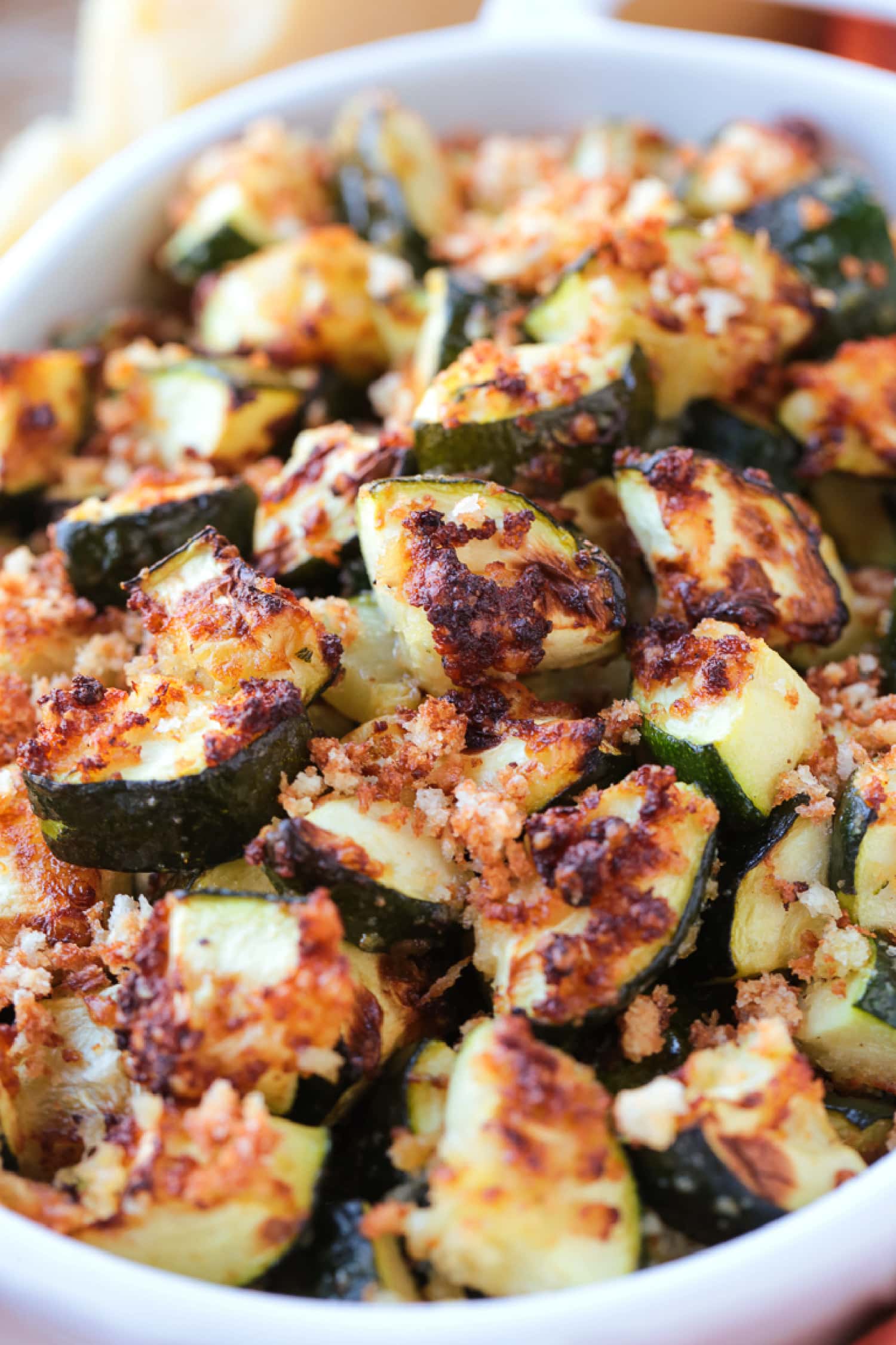 A close up of air fryer zucchini in an oven dish