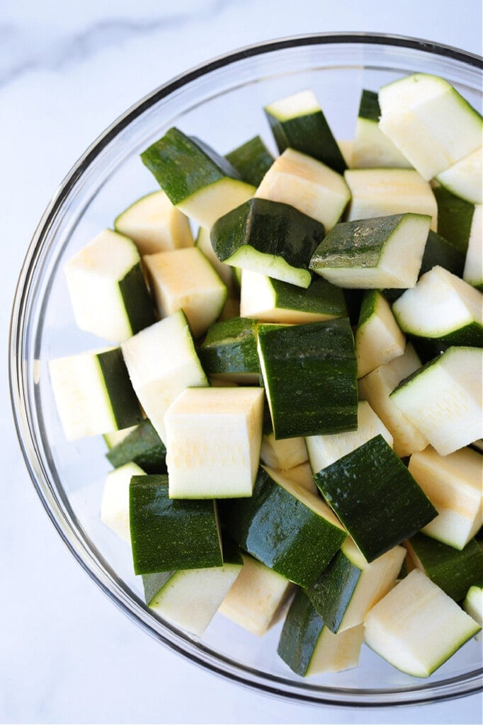 A bowl of cubed, raw zucchini