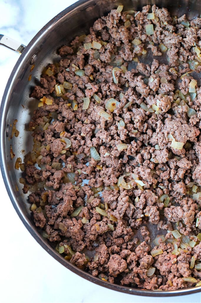 ground beef cooking in a skillet