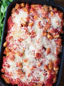 Casserole layered with pasta, chicken nuggets and cheese
