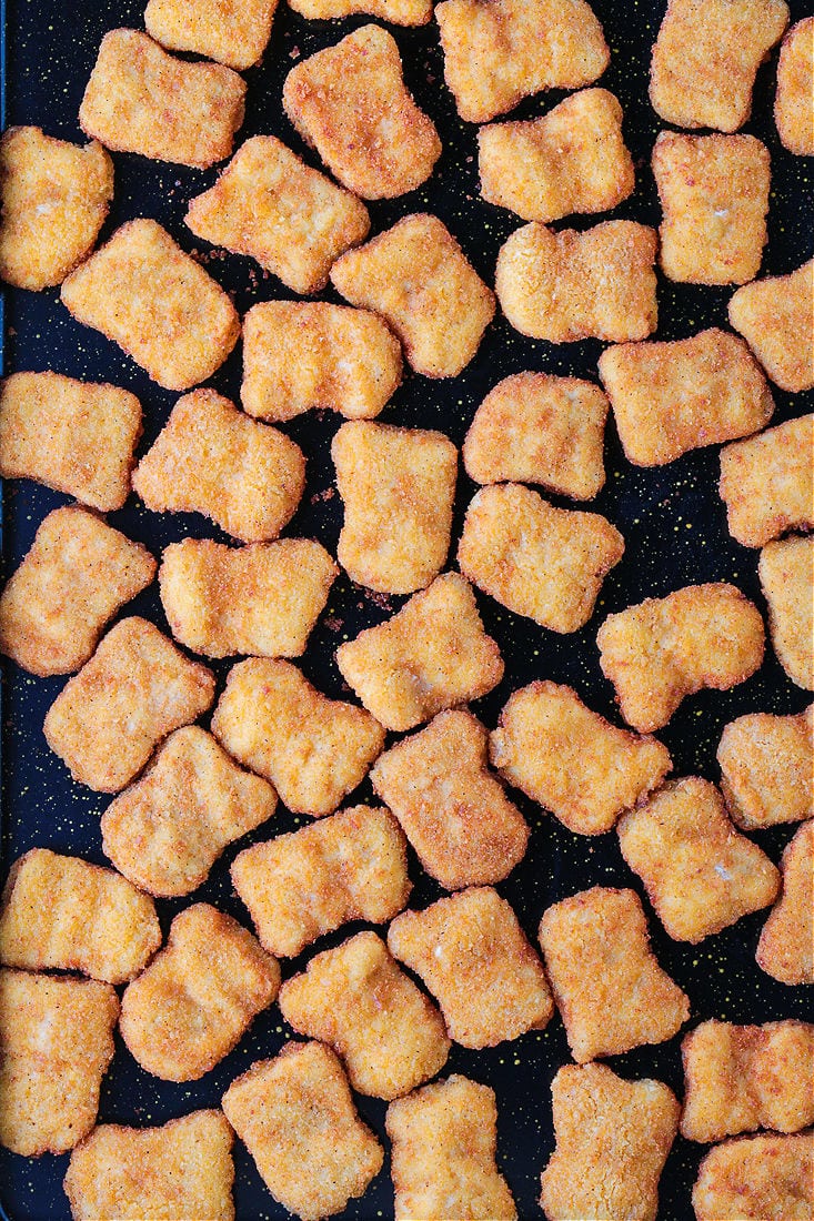 chicken nuggets on a baking sheet