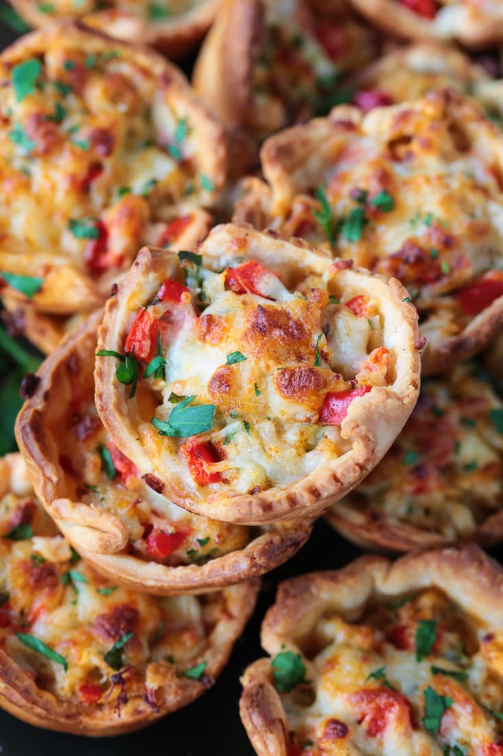 crab puff appetizers stacked on plate