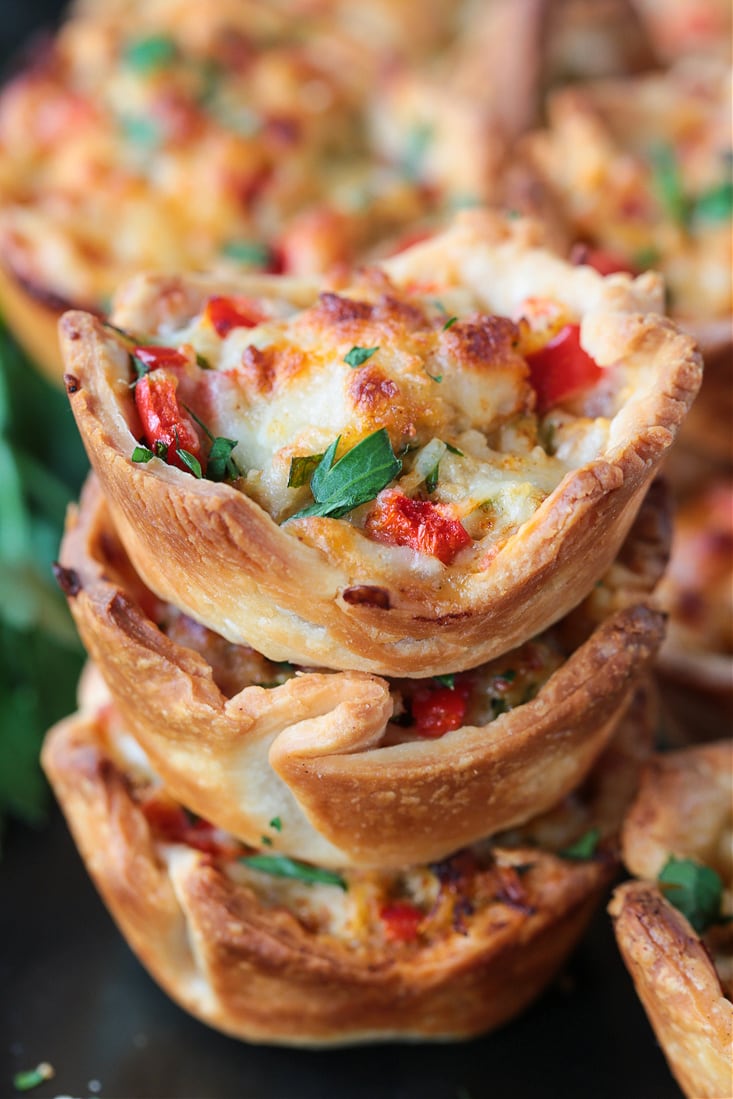 crab puffs stacked on a plate