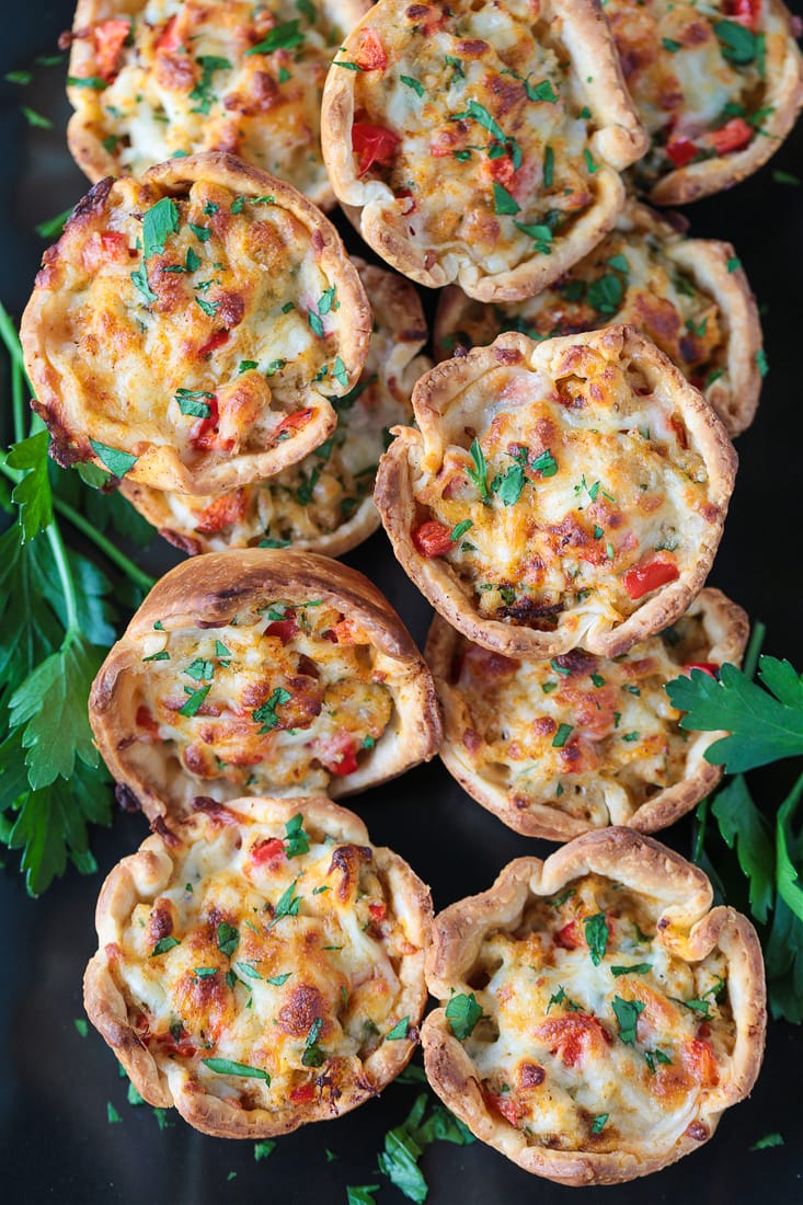 crab puffs on a black platter