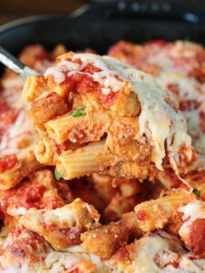 chicken parmesan casserole on a serving spoon