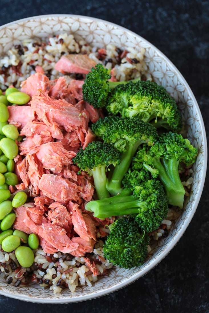 edamame, salmon and broccoli in a bowl with rice