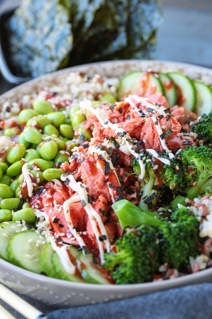 salmon rice bowl with sriracha mayo drizzle on top