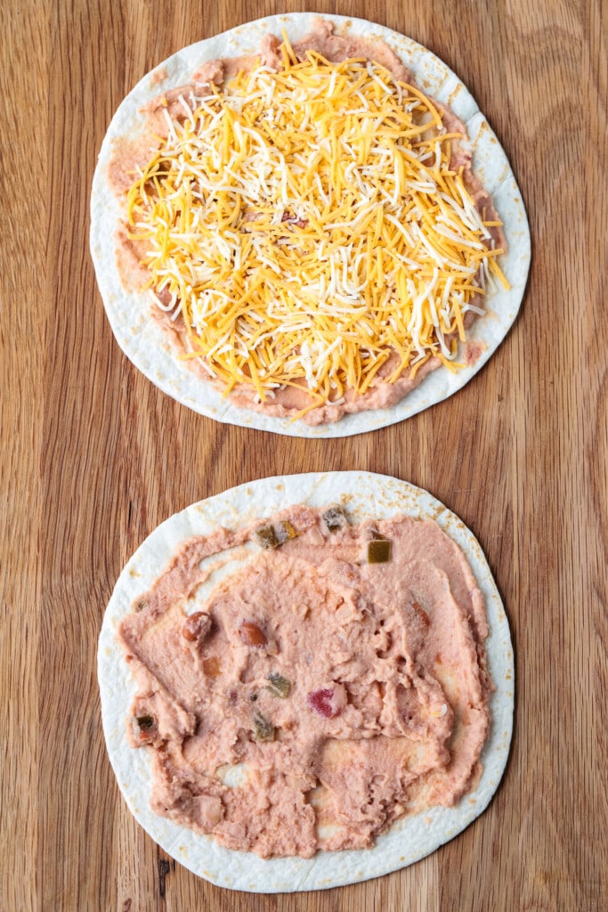 tortillas on board with cheese and refried beans