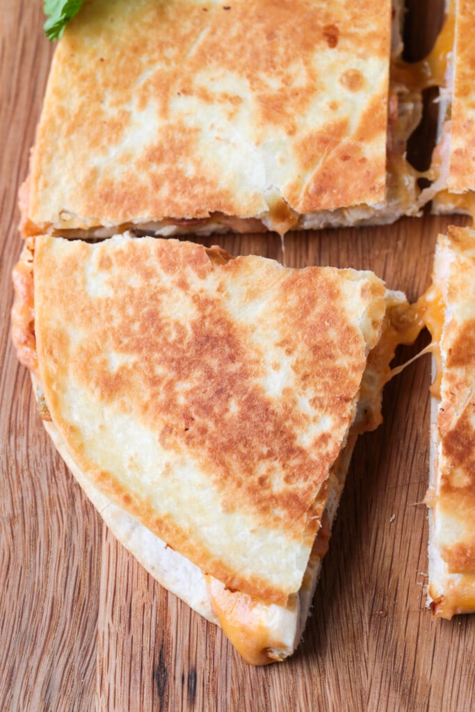 chicken quesadilla on board cut into fourths