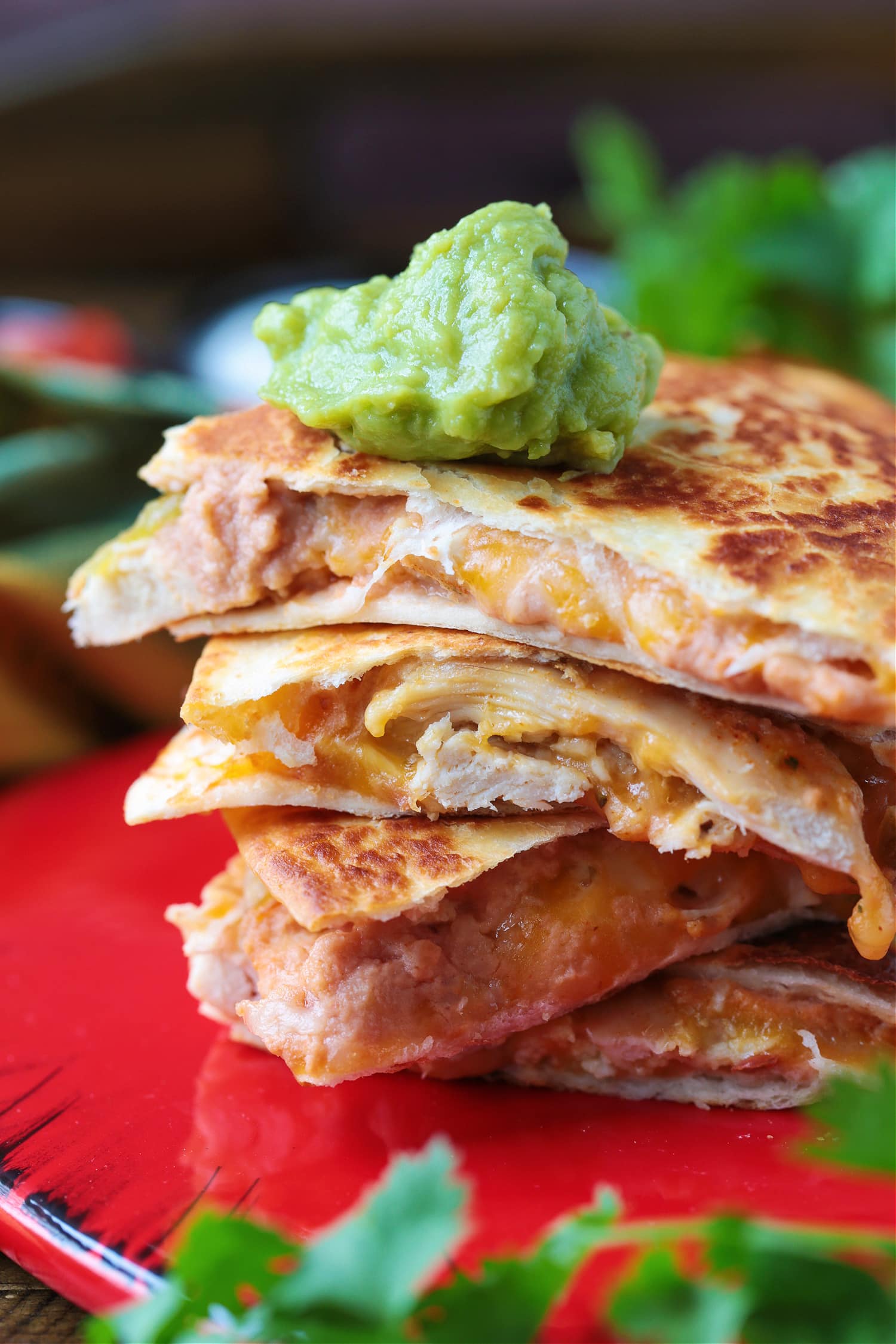 chicken quesadillas with guacamole on top