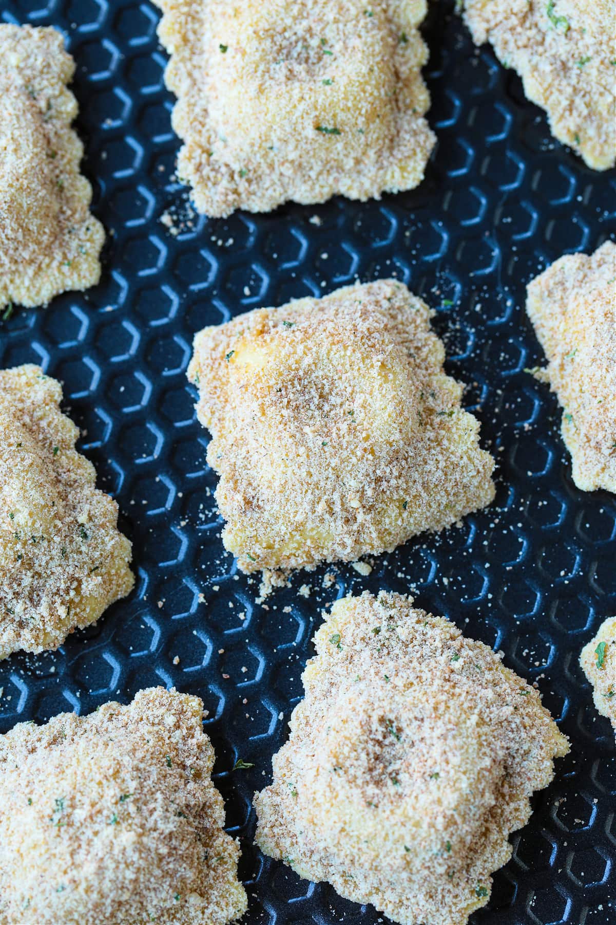 breaded ravioli on sheet pan