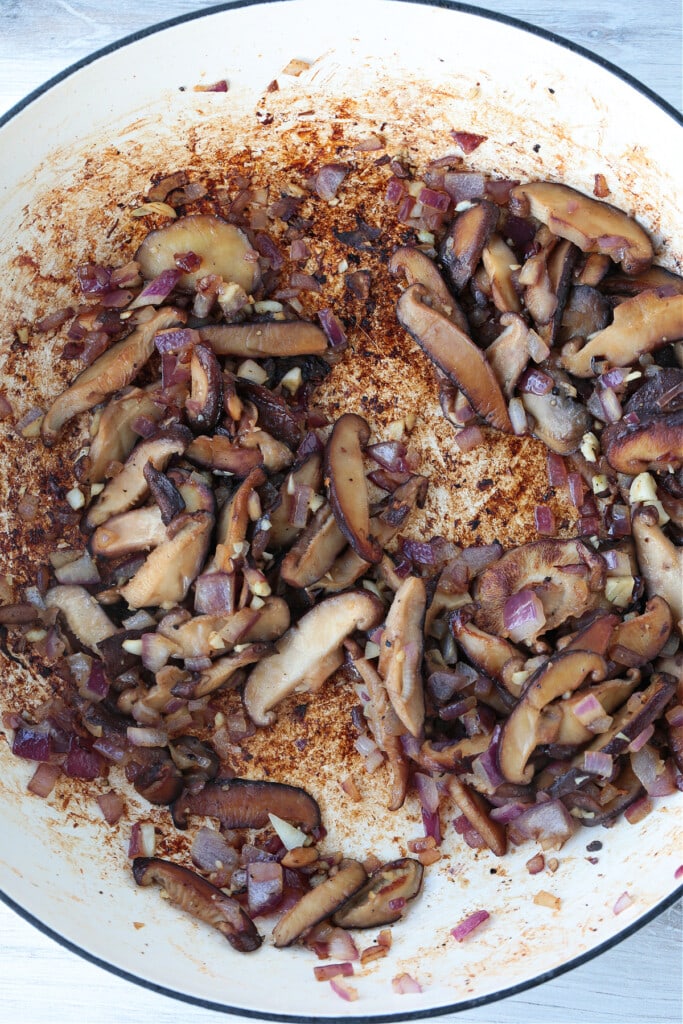 browned mushrooms and onions in a skillet