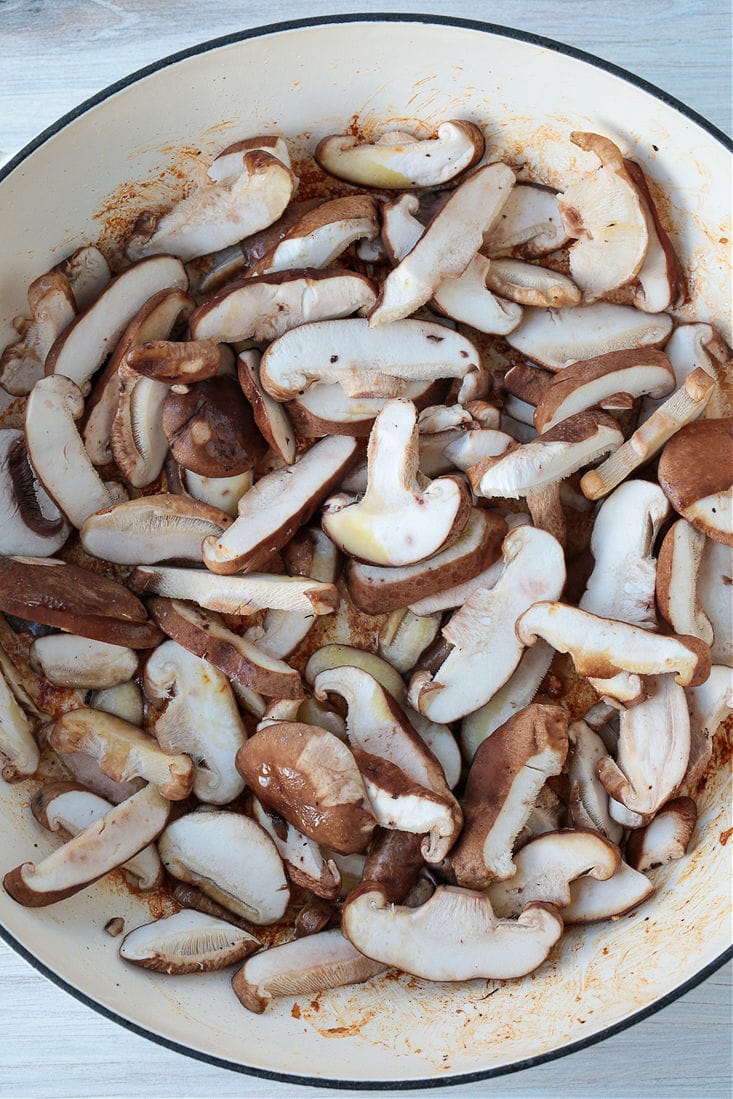 Raw shiitake mushroom slices in a pot