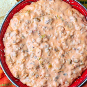 sausage cheese dip in bowl with chips on the side