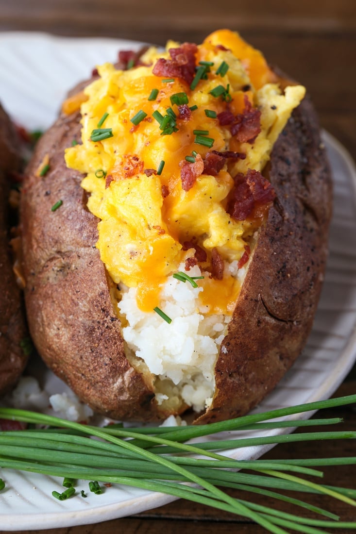 baked potatoes stuffed with eggs, cheese and bacon