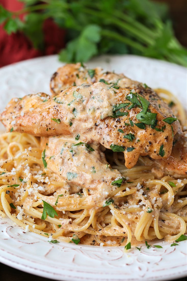 chicken lazone on a bed of spaghetti