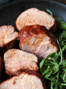 sliced pork tenderloin with arugula salad