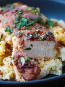 sliced chicken on a plate with rice