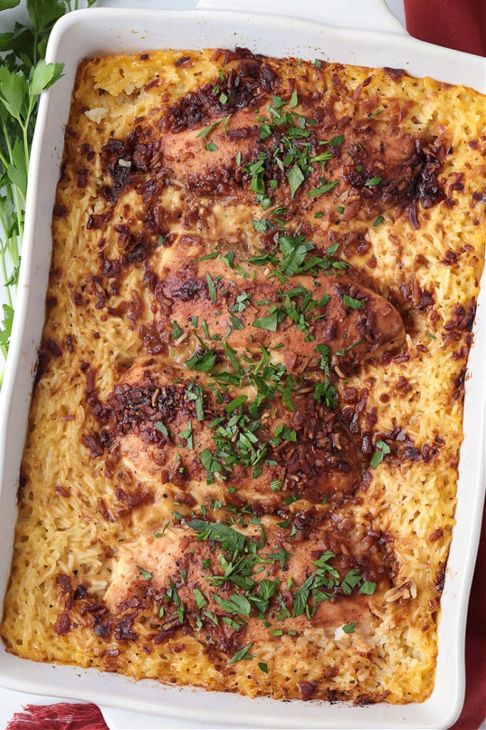 chicken breasts in casserole dish with soup and rice