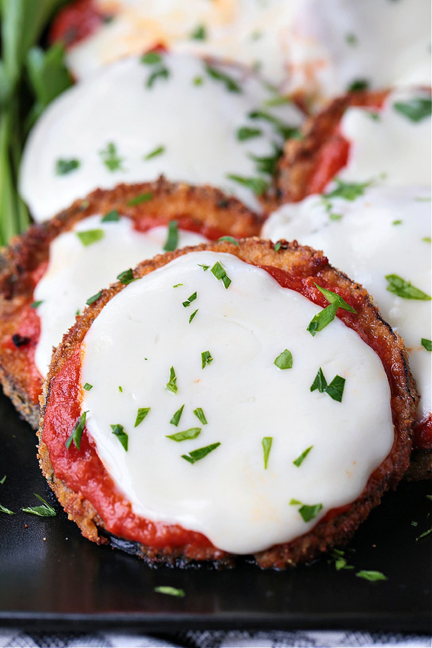 Sliced, breaded Eggplant topped with sauce and cheese