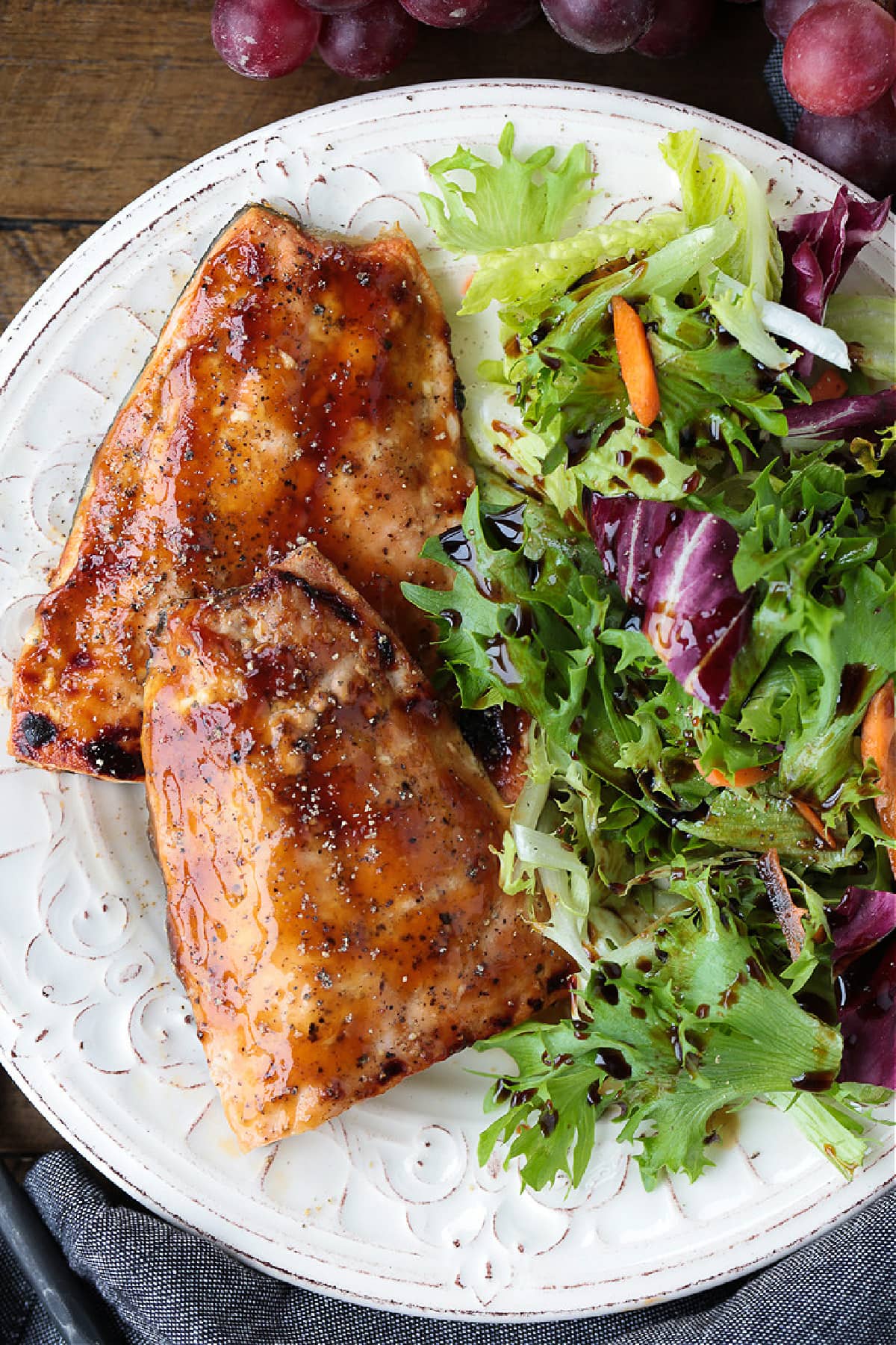 teriyaki glazed salmon on a plate with salad