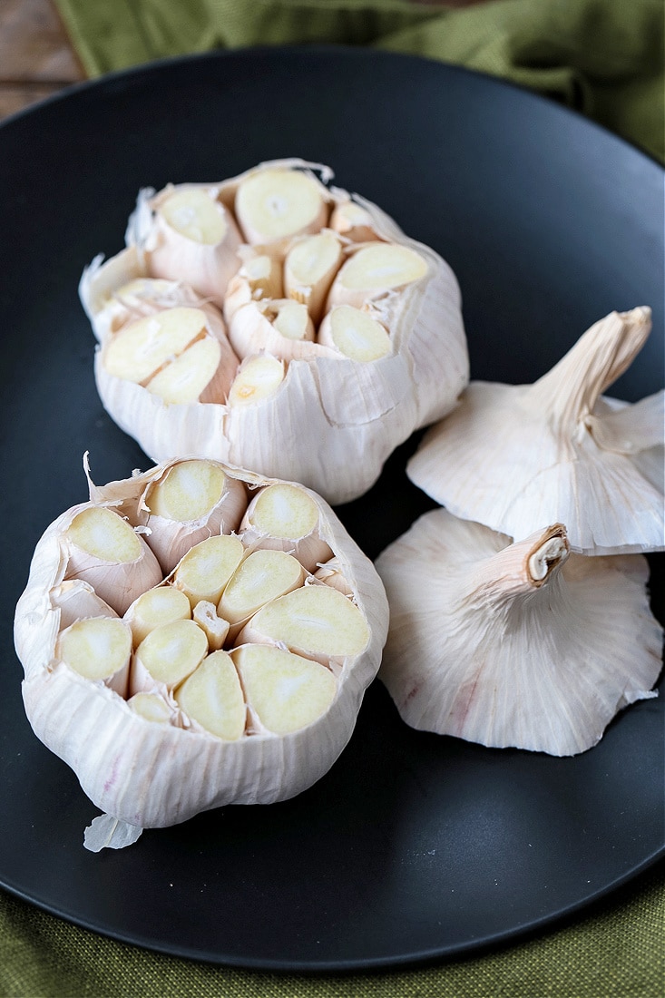 garlic heads with the top cut off