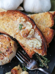 roasted garlic spread onto toast points