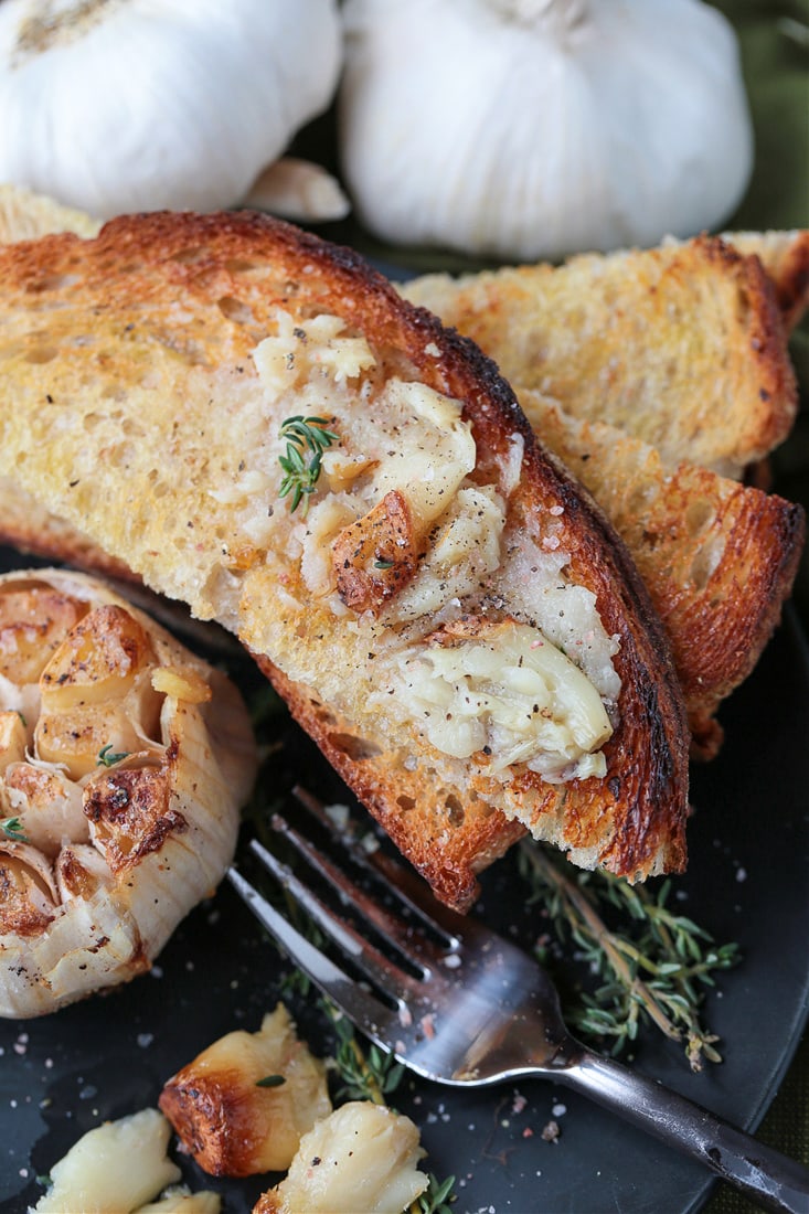 roasted garlic spread onto toast points