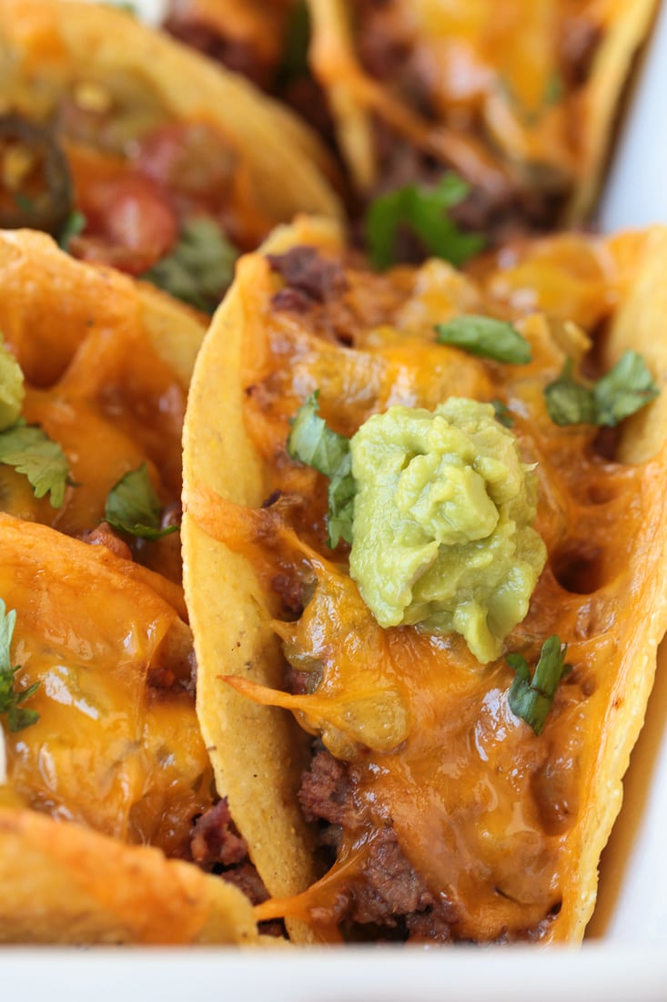 beef taco with cheese and guacamole