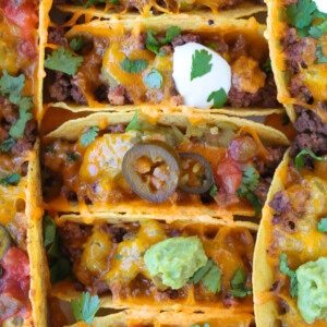 baked tacos in baking dish with toppings