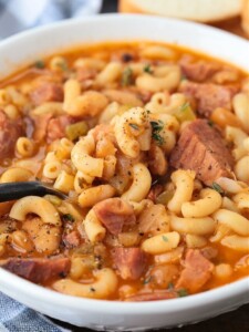 ham and macaroni soup in a bowl with spoon