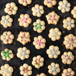 spritz cookies on a baking sheet