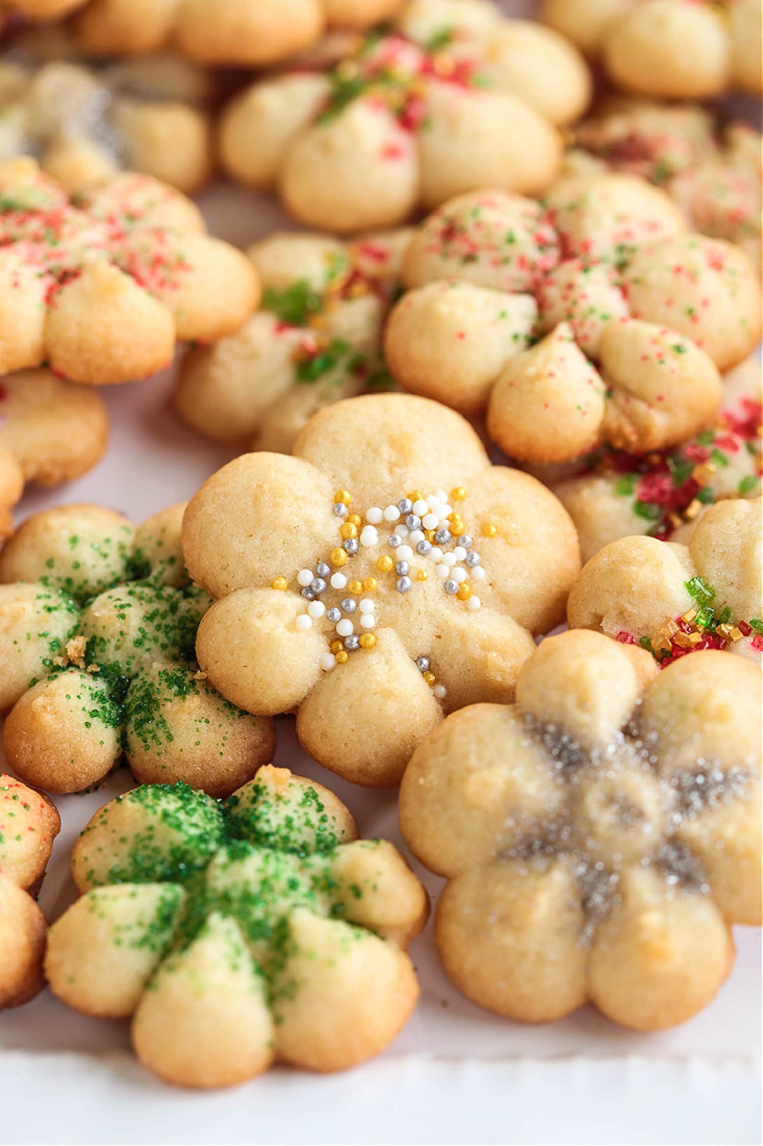 spritz cookies with sprinkles on plate