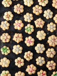 spritz cookies on a baking sheet