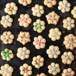 spritz cookies on a baking sheet