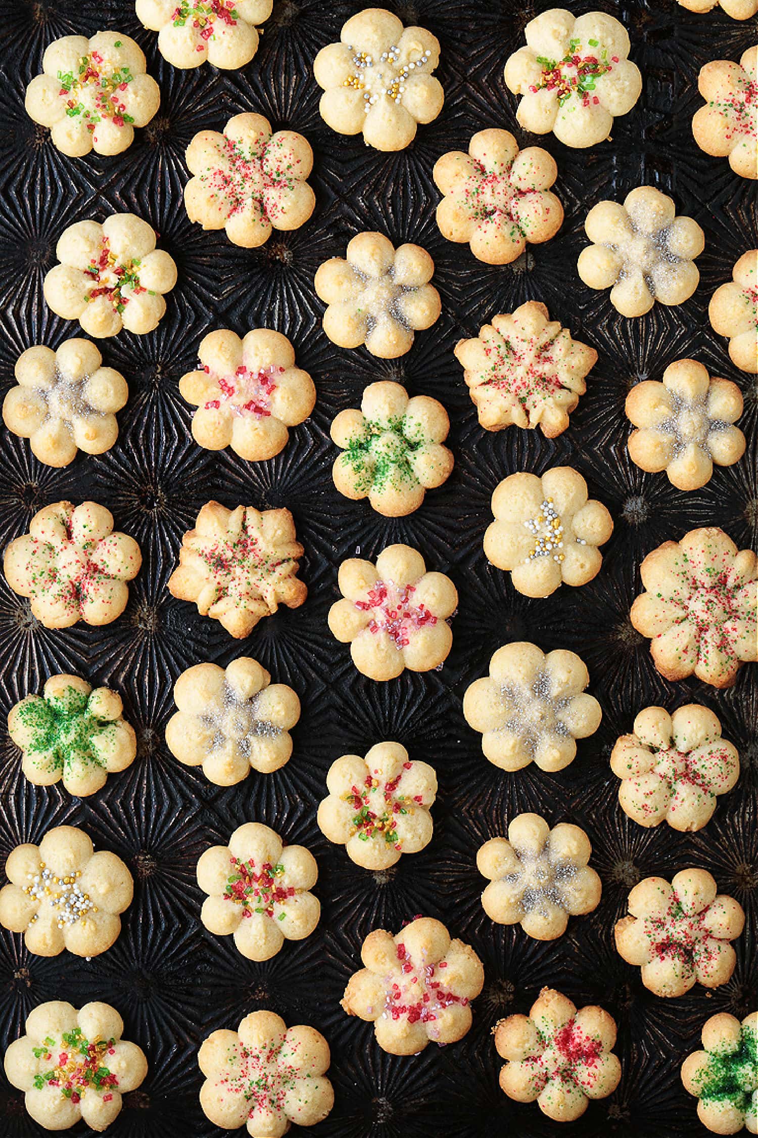 spritz cookies on a baking sheet