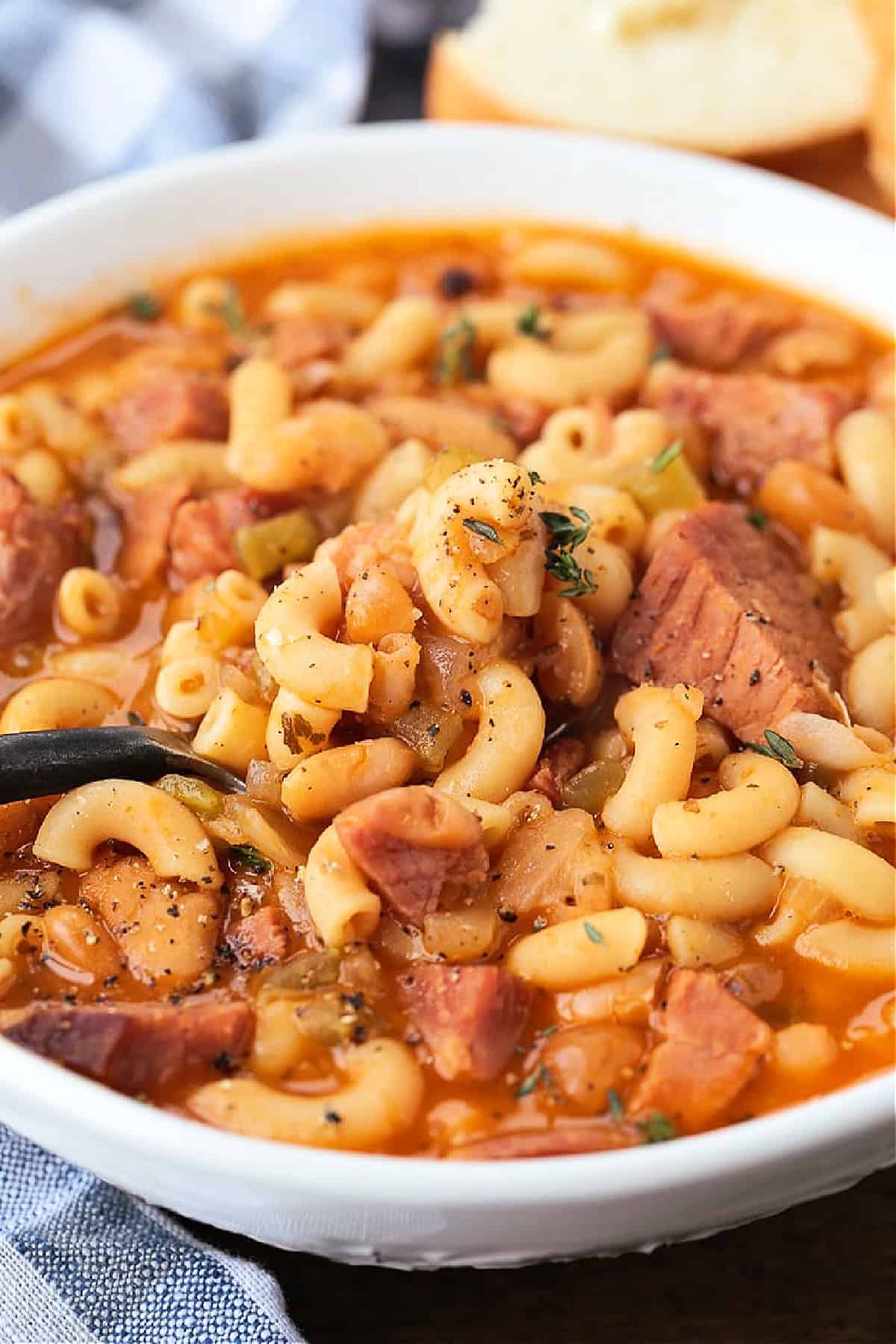 spoon in a bowl of pasta fagioli