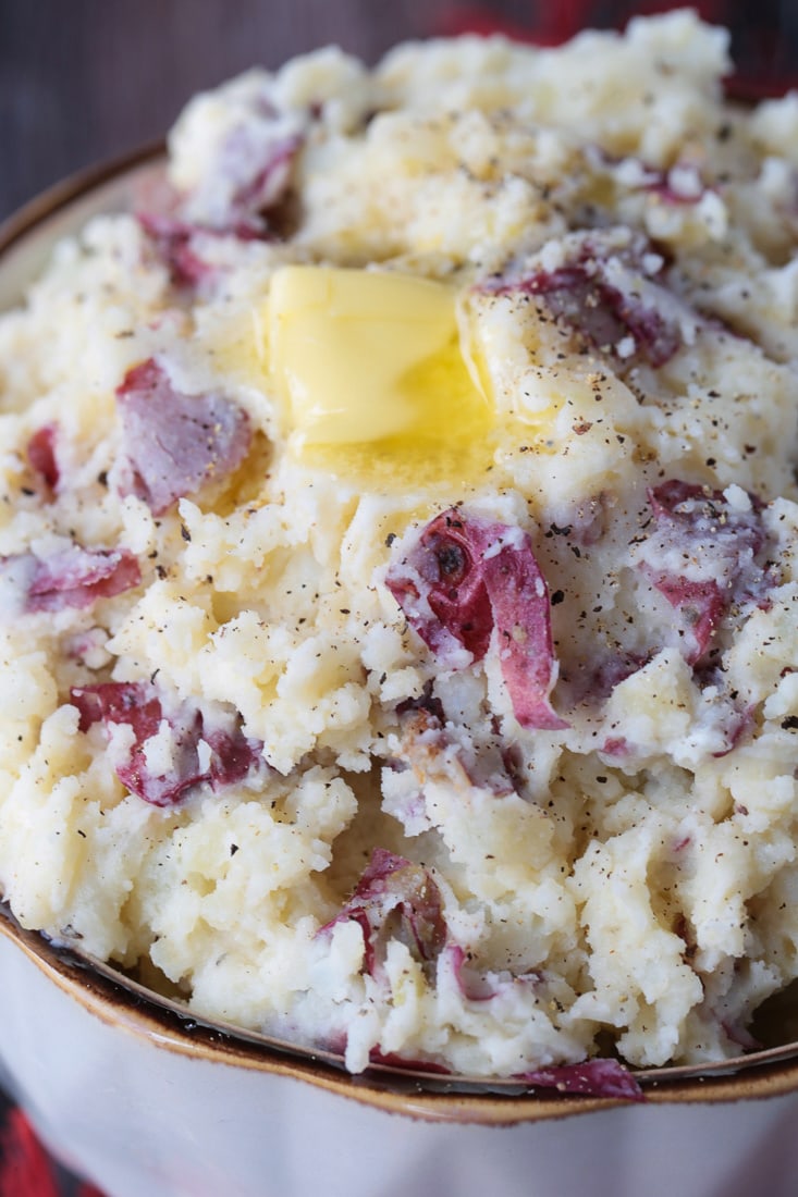 red skin mashed potatoes in bowl with butter