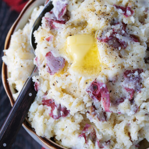 red skin mashed potatoes in bowl with butter