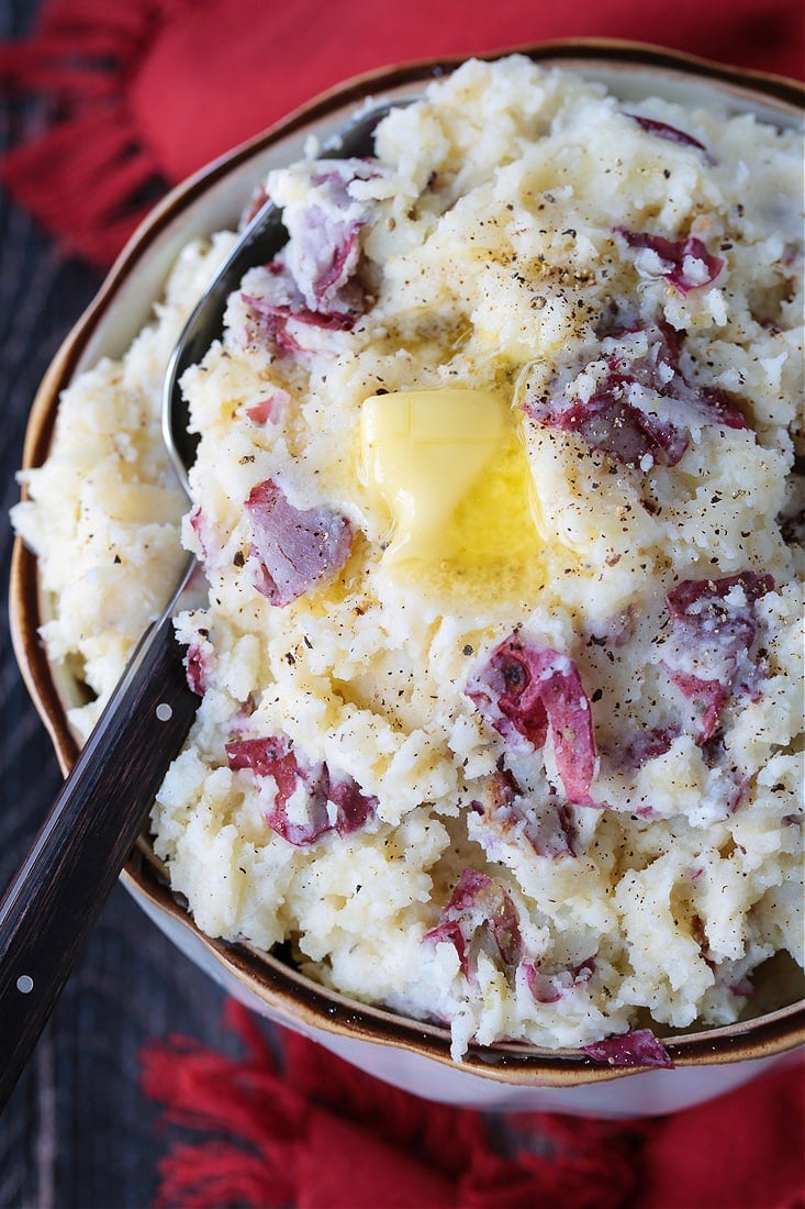 red skin mashed potatoes in bowl with butter