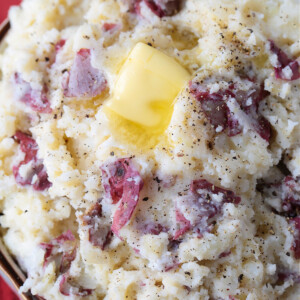 skin on mashed potatoes in bowl with butter