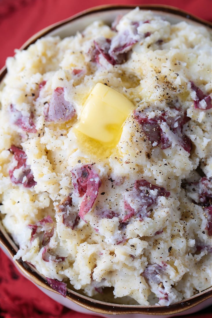 skin on mashed potatoes in bowl with butter