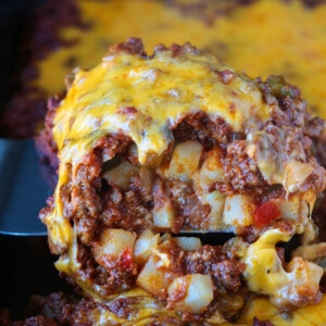 ground beef casserole with potatoes and cheese on top