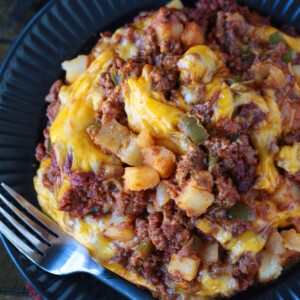 sloppy joe casserole on black plate with fork