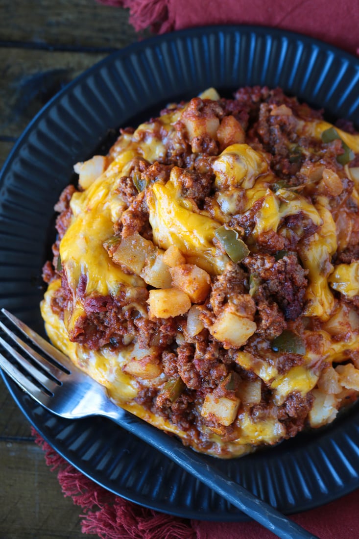 sloppy joe casserole on black plate with fork