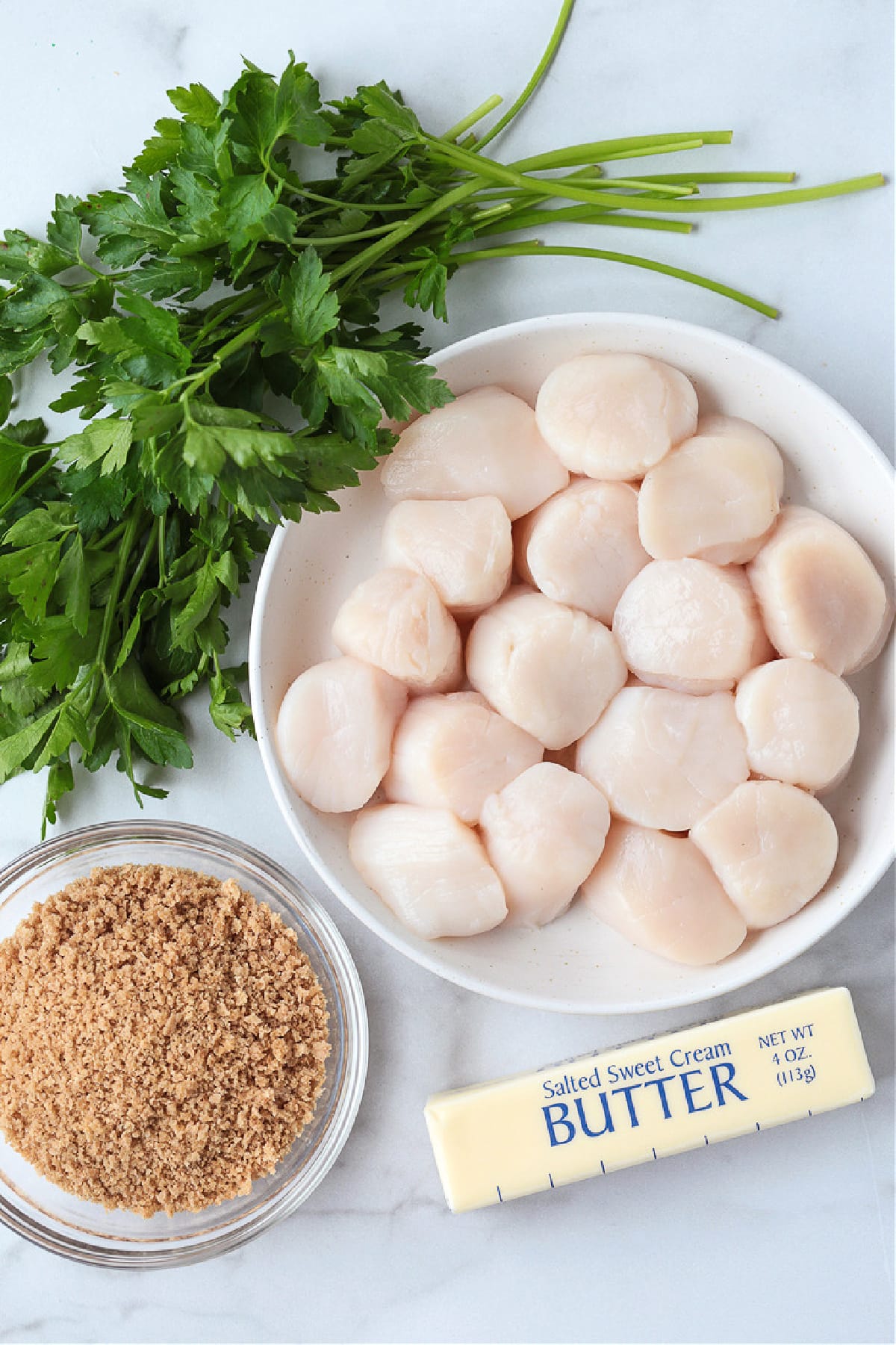 These Air Fryer Scallops are perfectly cooked and are melt in your mouth tender. An easy seafood dinner recipe for any occasion! ingredients for making air fryer scallops