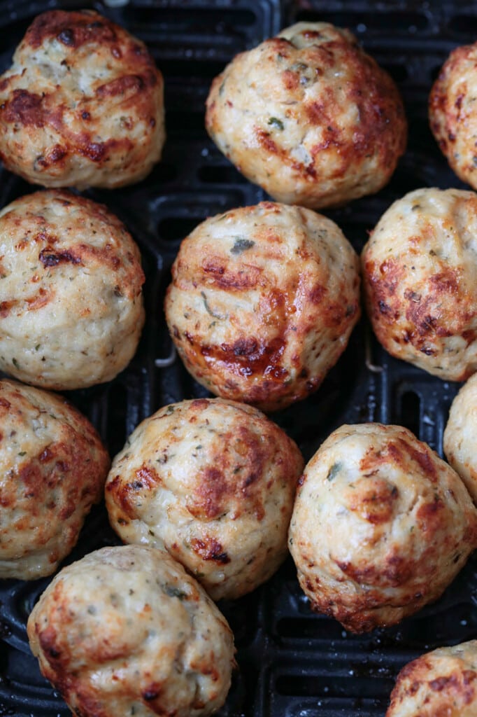 turkey meatballs in an air fryer cooked until golden brown